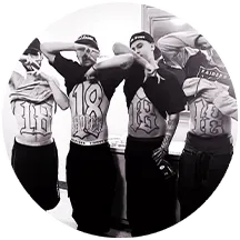 Gangers from the 18th Street Gang throwing up gang signs and showing off their "18" tattoos