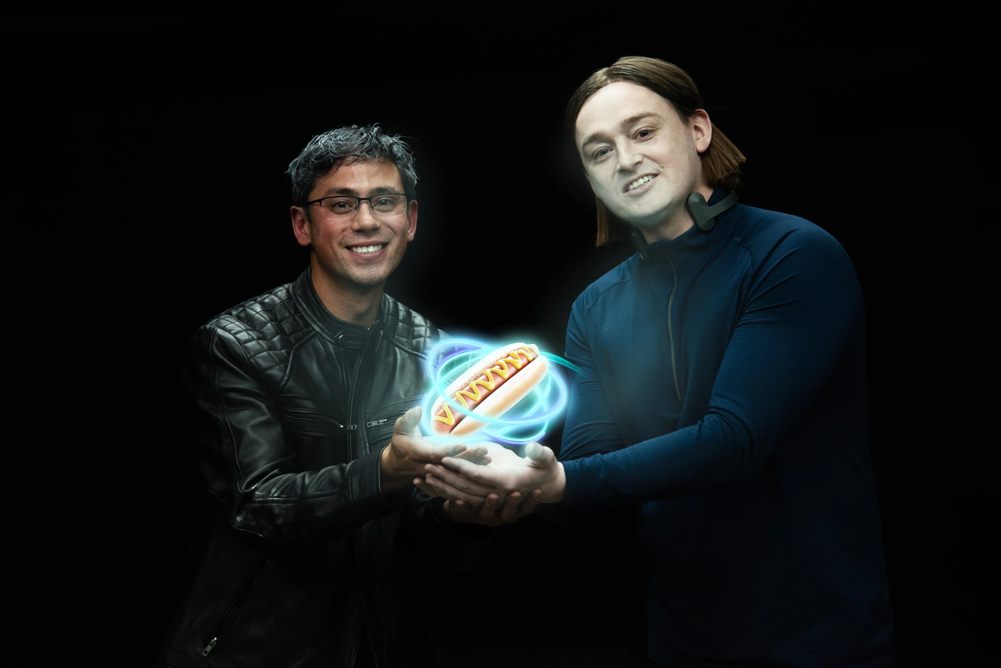 Malcolm and Spencer controlling a floating hotdog with arcane energy