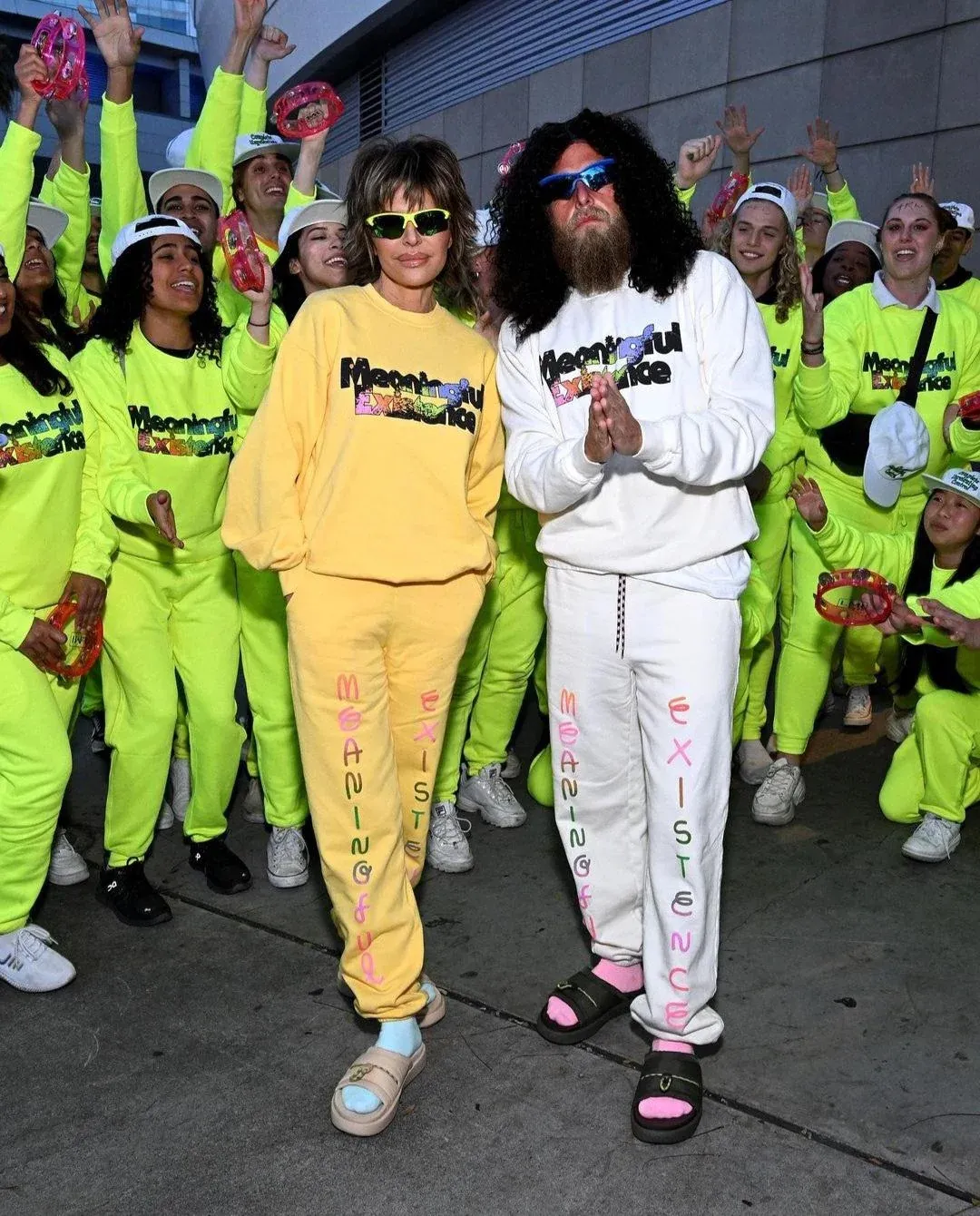 Prophet and Lisa Rinna surrounded by devotees.