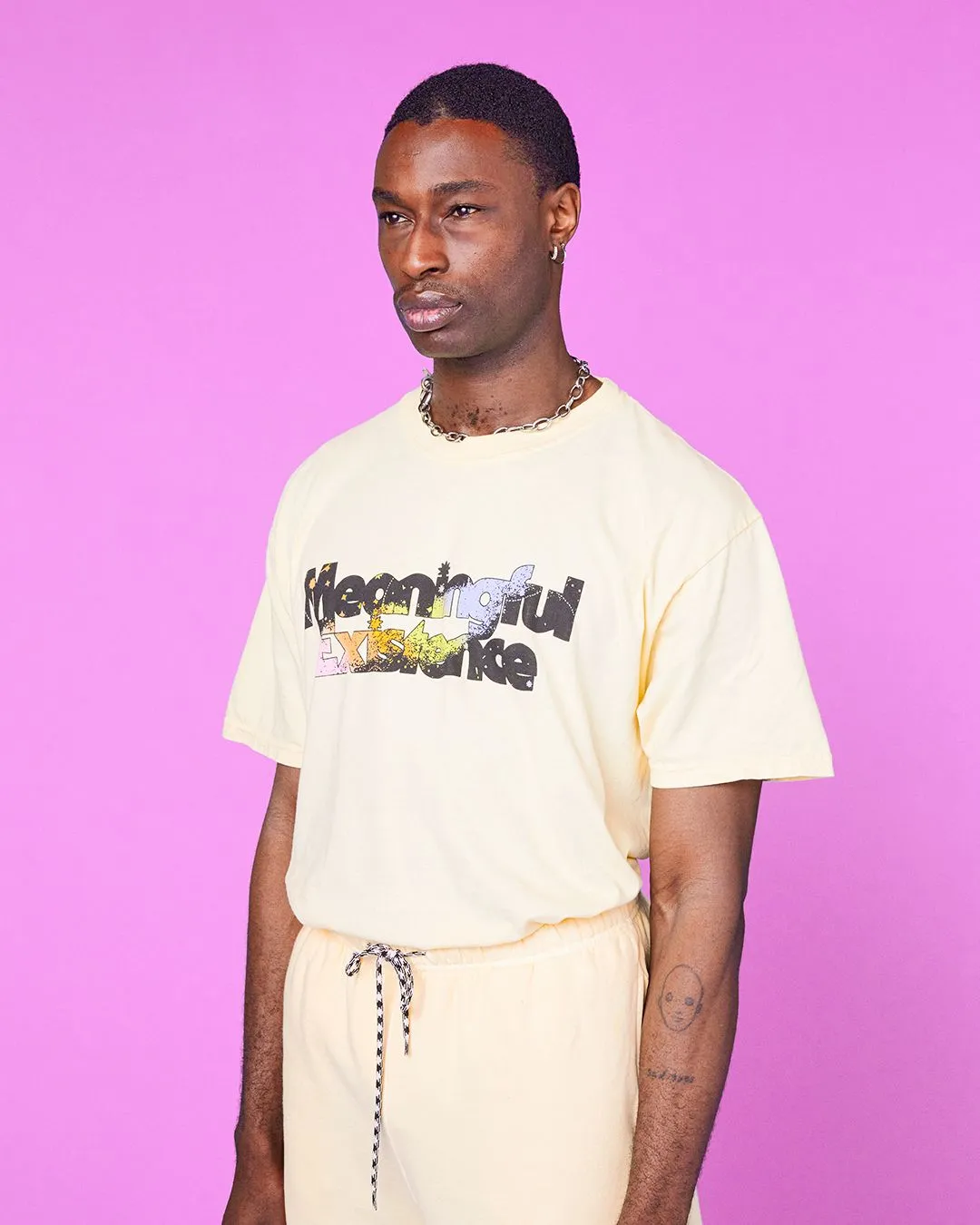 A model showing off a Meaningful Existence tee