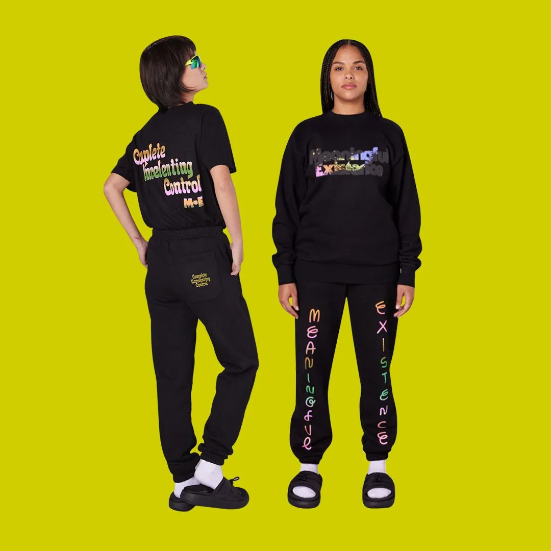 Two models showing off sweatsuits over a neon yellow background